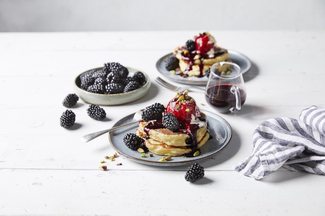 Fluffy pancakes with blackberry sauce