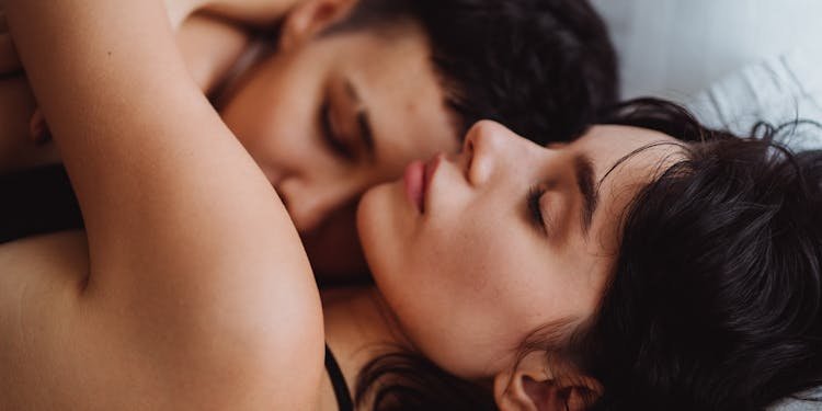 A tender embrace between a loving couple, showcasing intimacy and affection indoors.