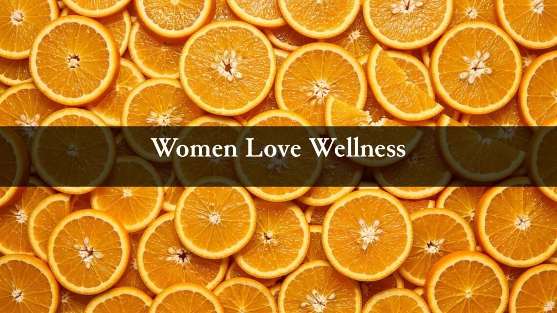 Women Love Wellness logo over sliced oranges